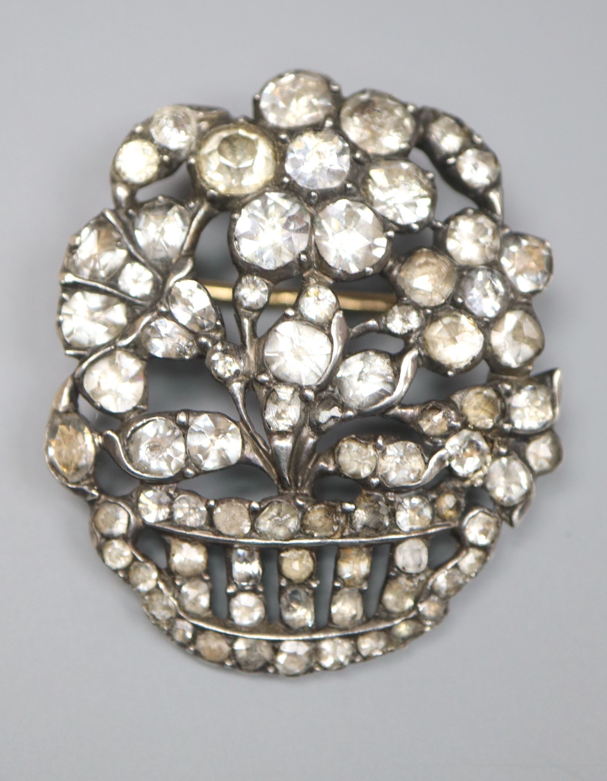 An early-mid 20th century white metal and paste set giardinetto brooch, 33mm, gross 9.4 grams.